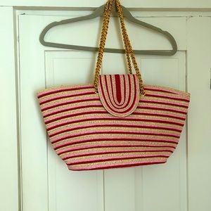 Zippered pink,tan, red & gold tote bag. With gold tone metal handles.